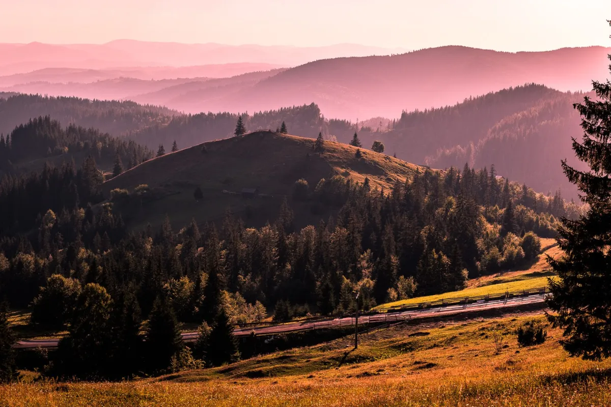 Sunset over the forested hills of Bucovina